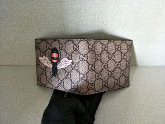 G*u*i  with plaid  bee wallets